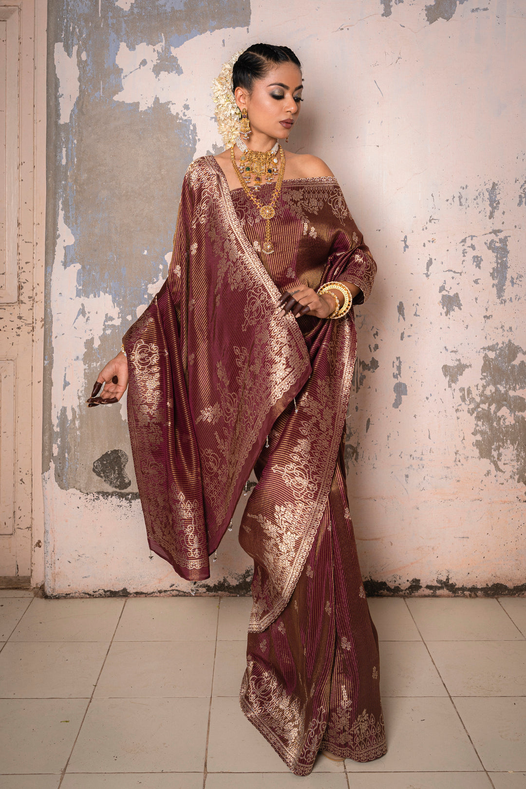 Tissue Maroon Taby Saree with Jari Lining, Small Flower Buttis, and Handmade Tassels