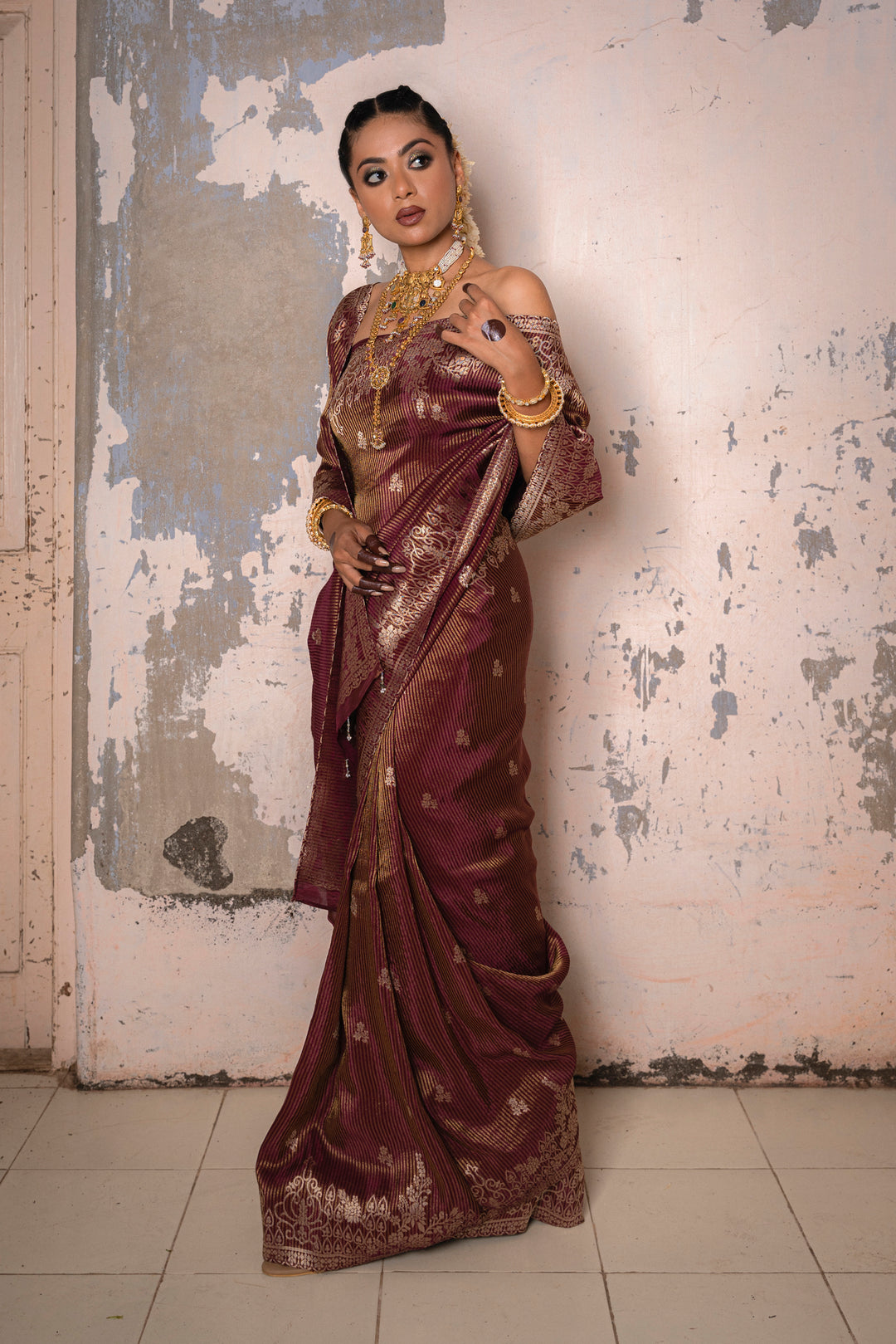 Tissue Maroon Taby Saree with Jari Lining, Small Flower Buttis, and Handmade Tassels