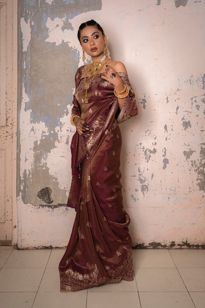 Tissue Maroon Taby Saree with Jari Lining, Small Flower Buttis, and Handmade Tassels