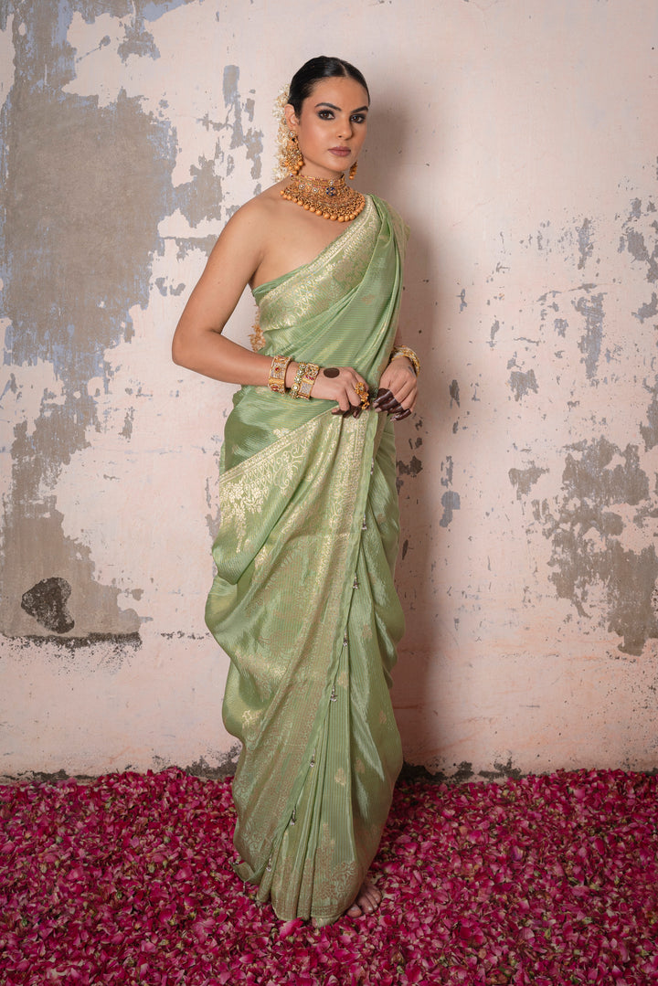 Tissue Green Taby Saree with Jari Lining, Small Flower Buttis, and Handmade Tassels