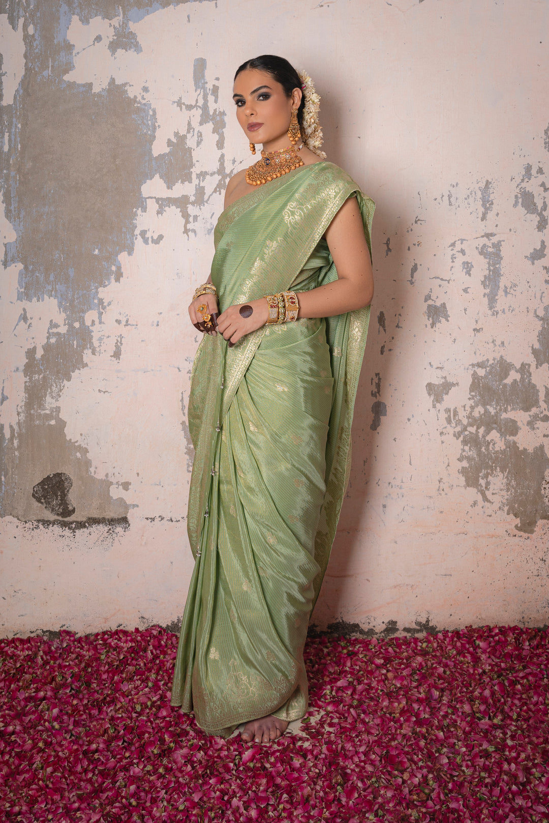 Tissue Green Taby Saree with Jari Lining, Small Flower Buttis, and Handmade Tassels