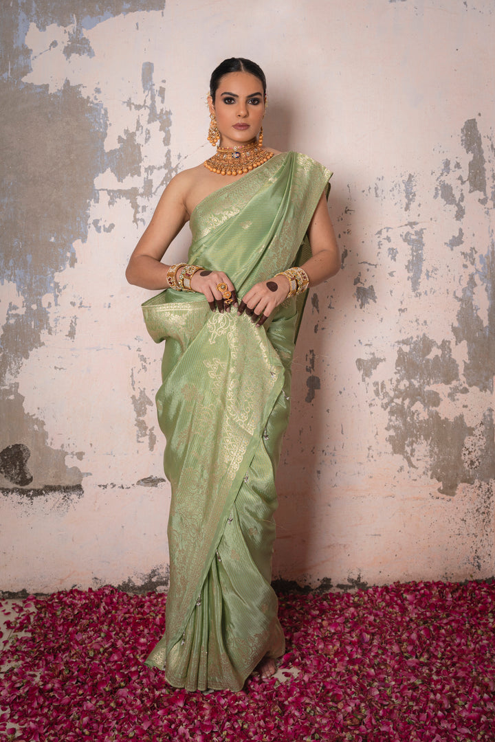 Tissue Green Taby Saree with Jari Lining, Small Flower Buttis, and Handmade Tassels