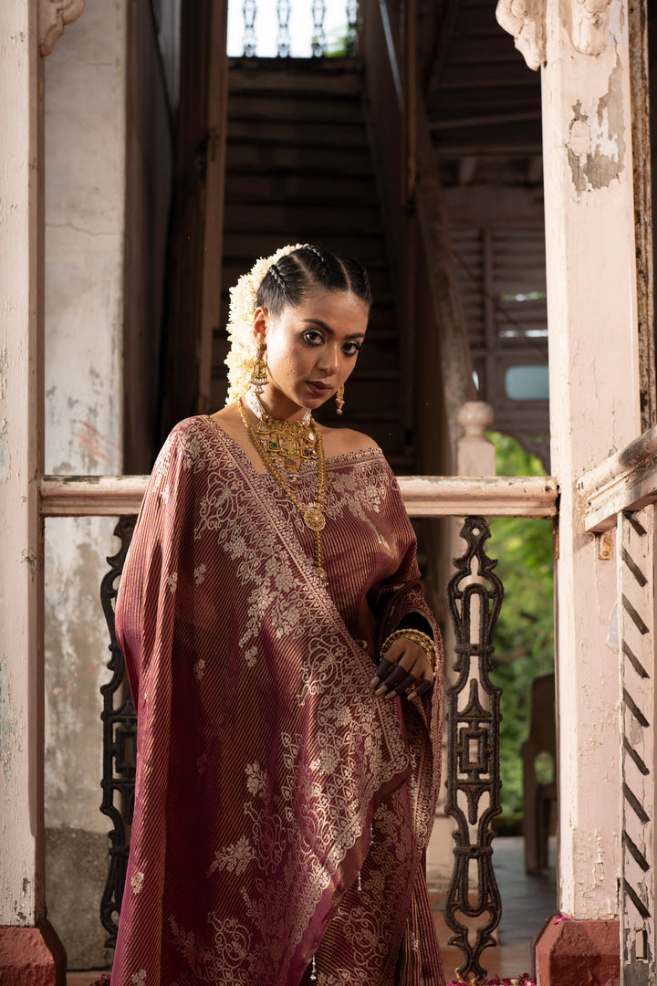 Tissue Maroon Taby Saree with Jari Lining, Small Flower Buttis, and Handmade Tassels