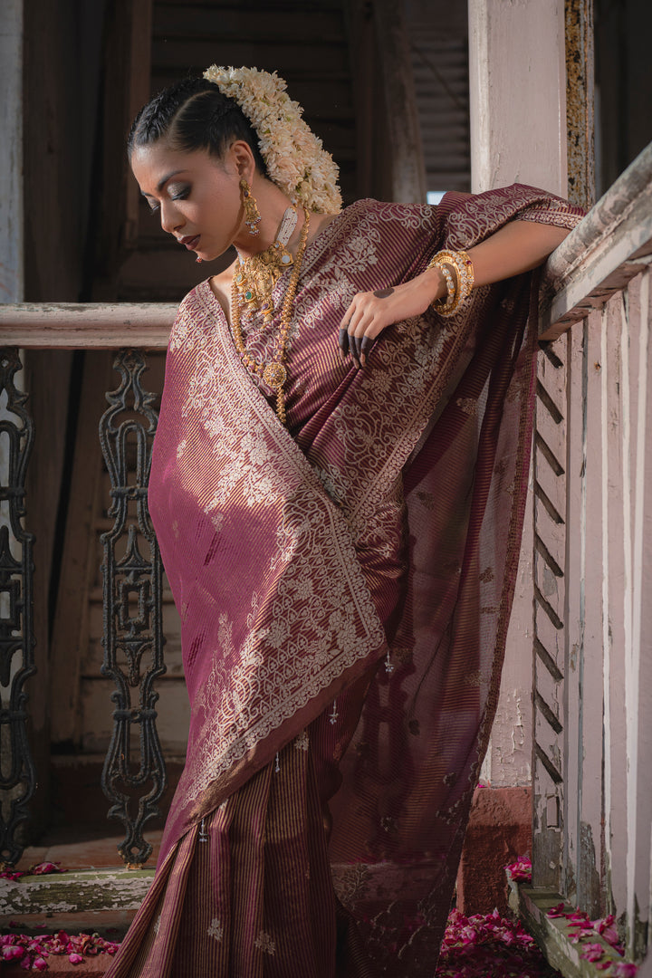 Tissue Maroon Taby Saree with Jari Lining, Small Flower Buttis, and Handmade Tassels